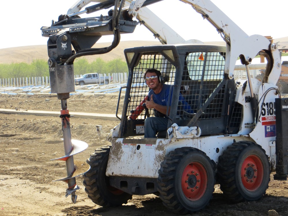 digging holes for the greenhouse